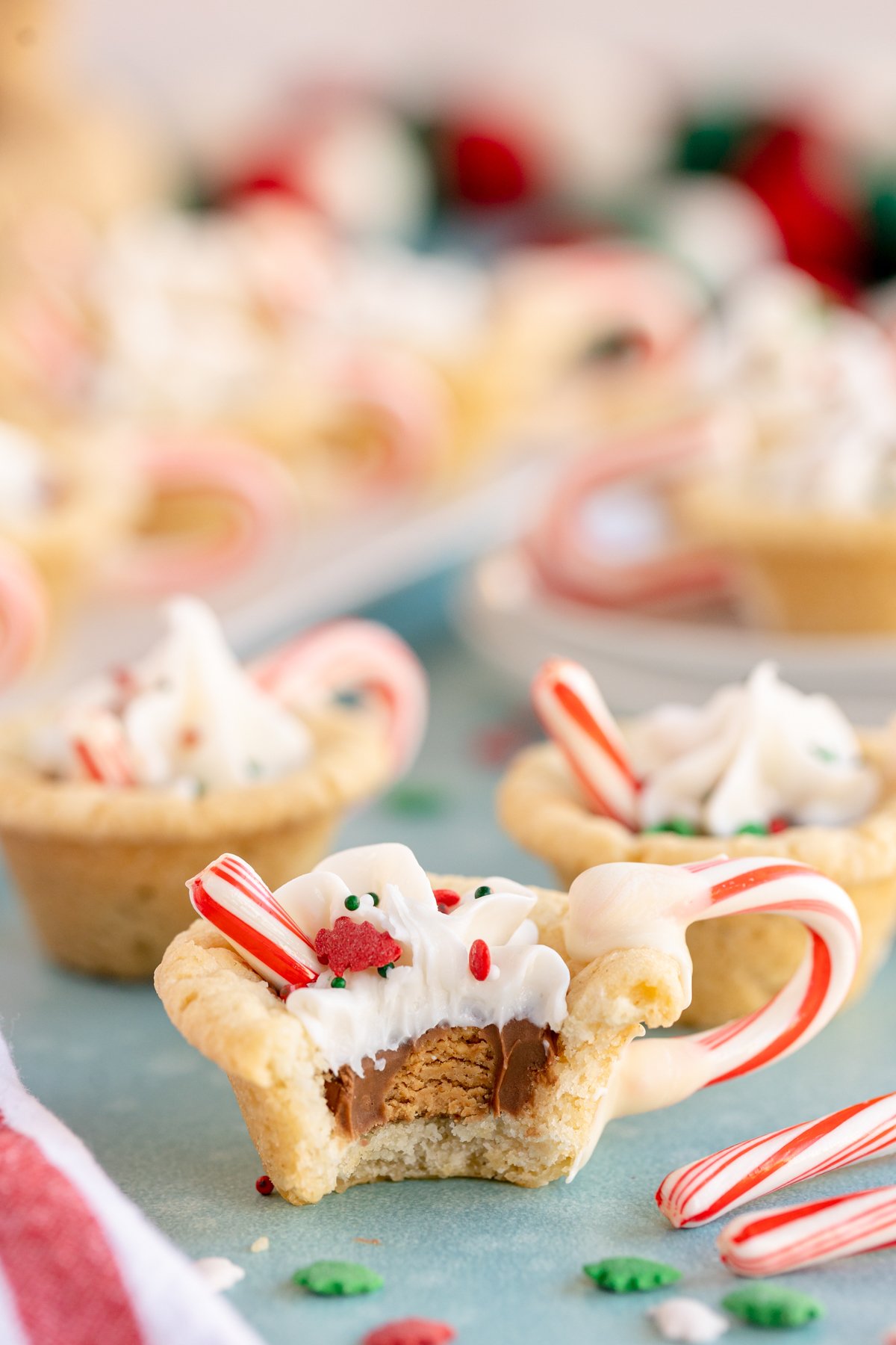 half eaten hot chocolate cookie cup showing peanut butter cup in the center