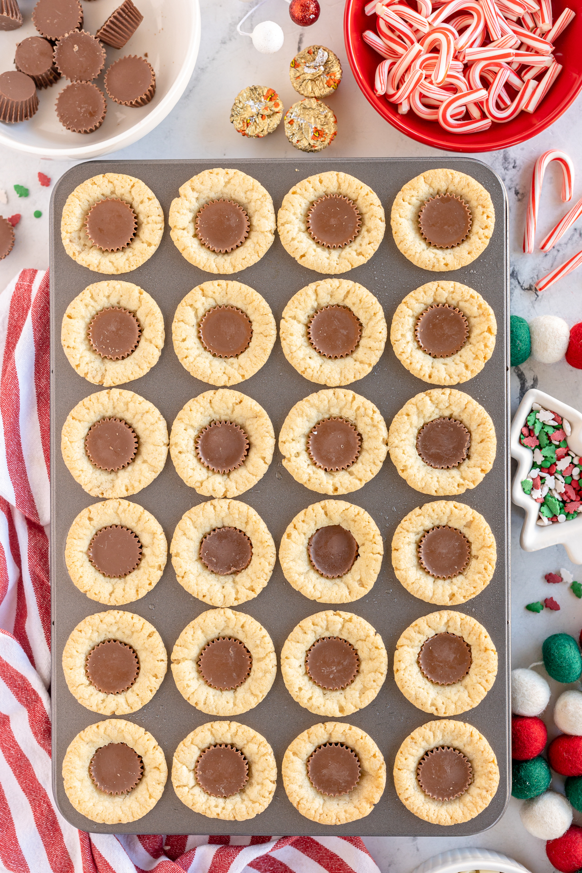 sugar cookie cups with peanut butter cups in the center
