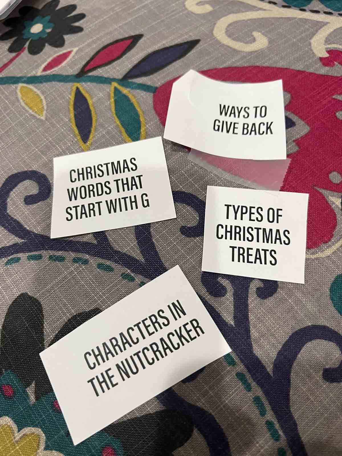Christmas categories on pieces of white paper