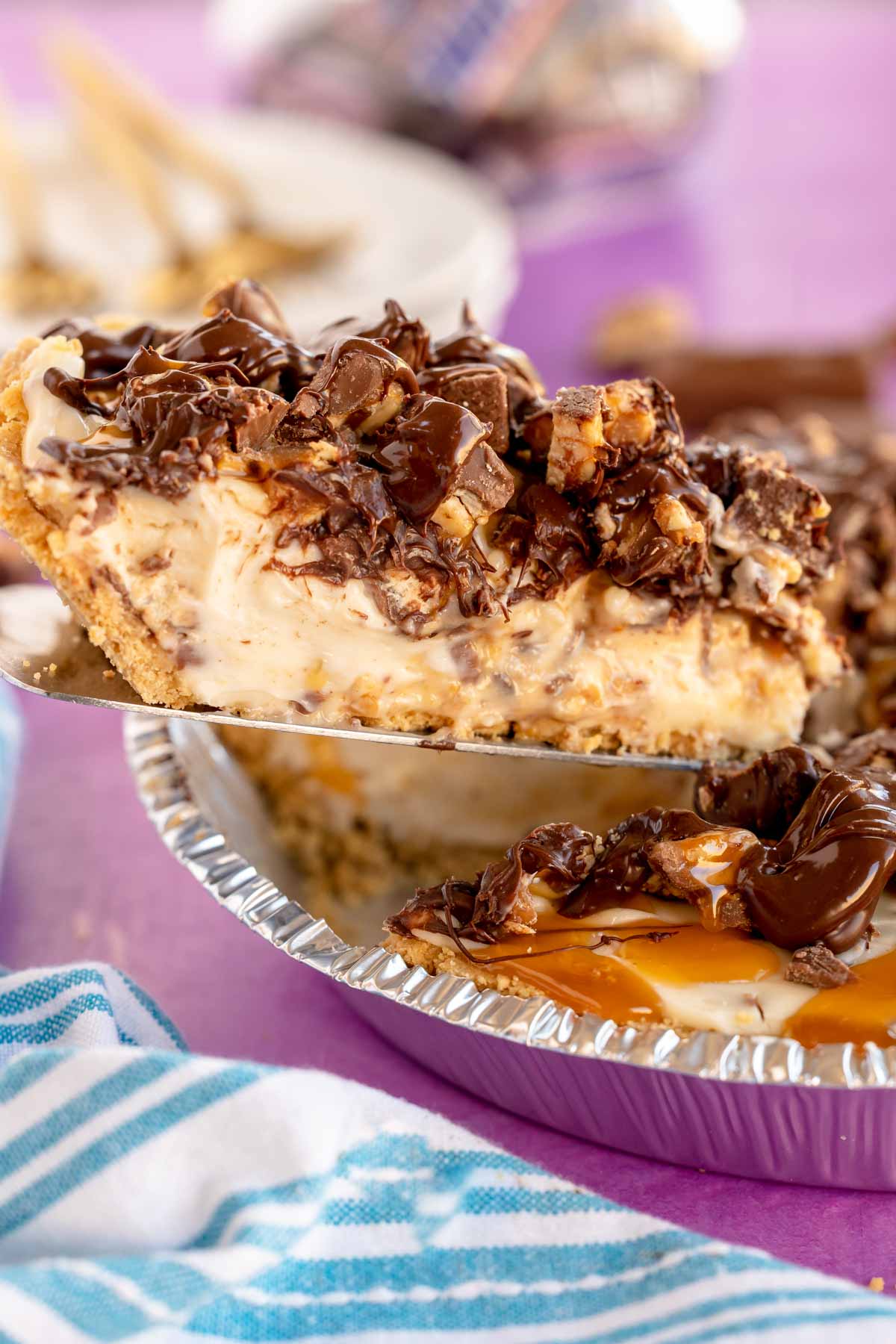 slice of snickers pie on a pie server