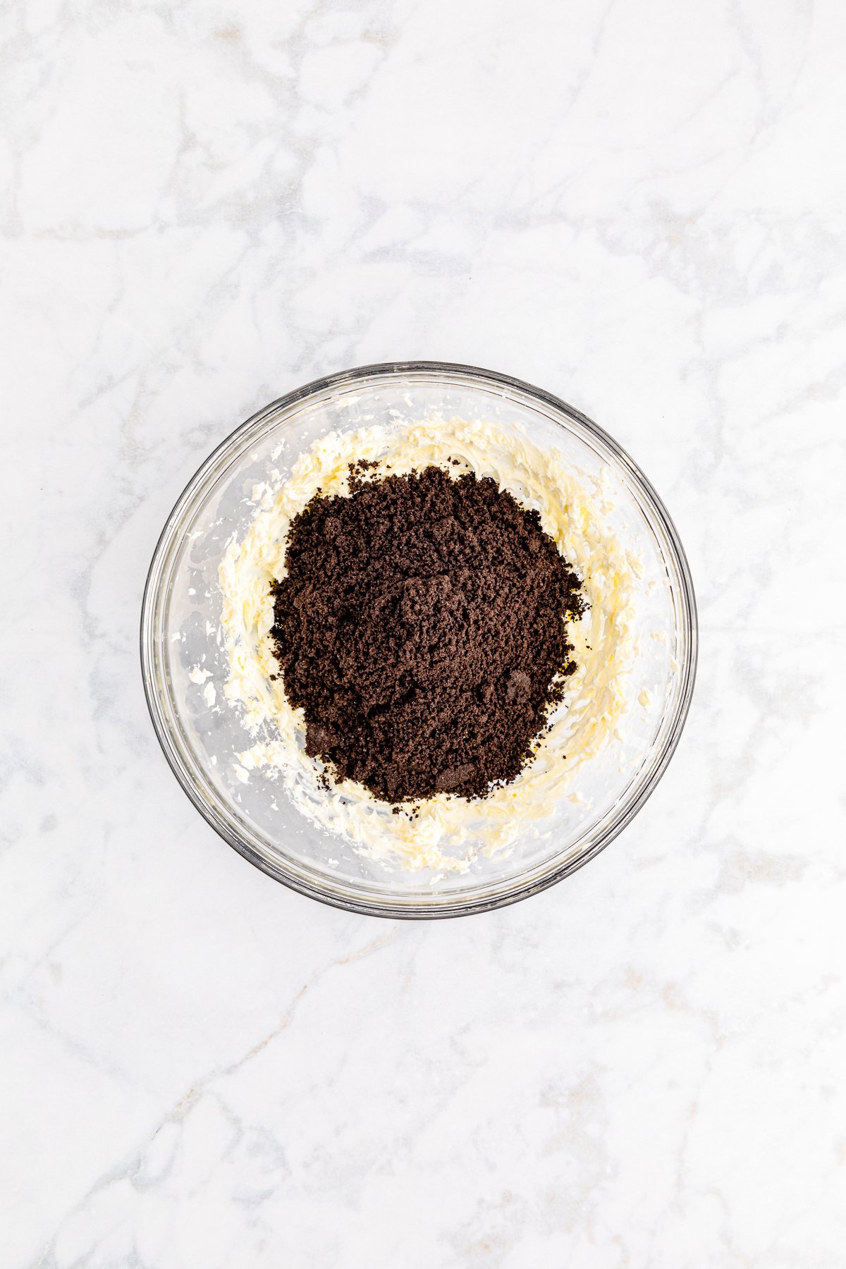 Oreo crumbs and cream cheese in a food processor