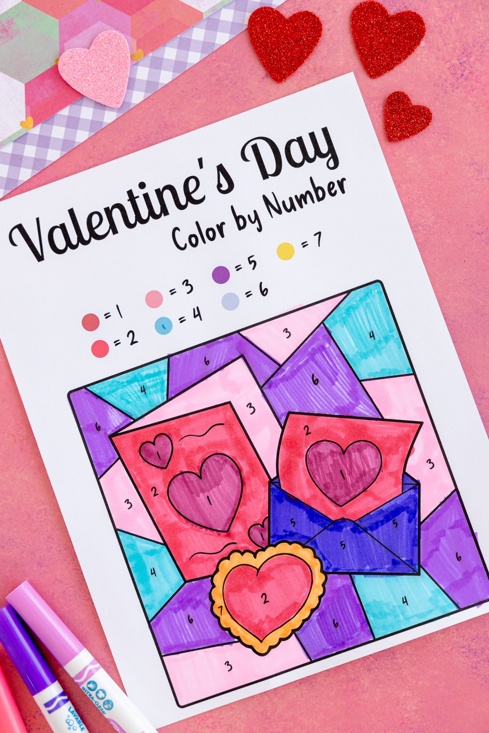 Filled in color by number page with Valentine letter design