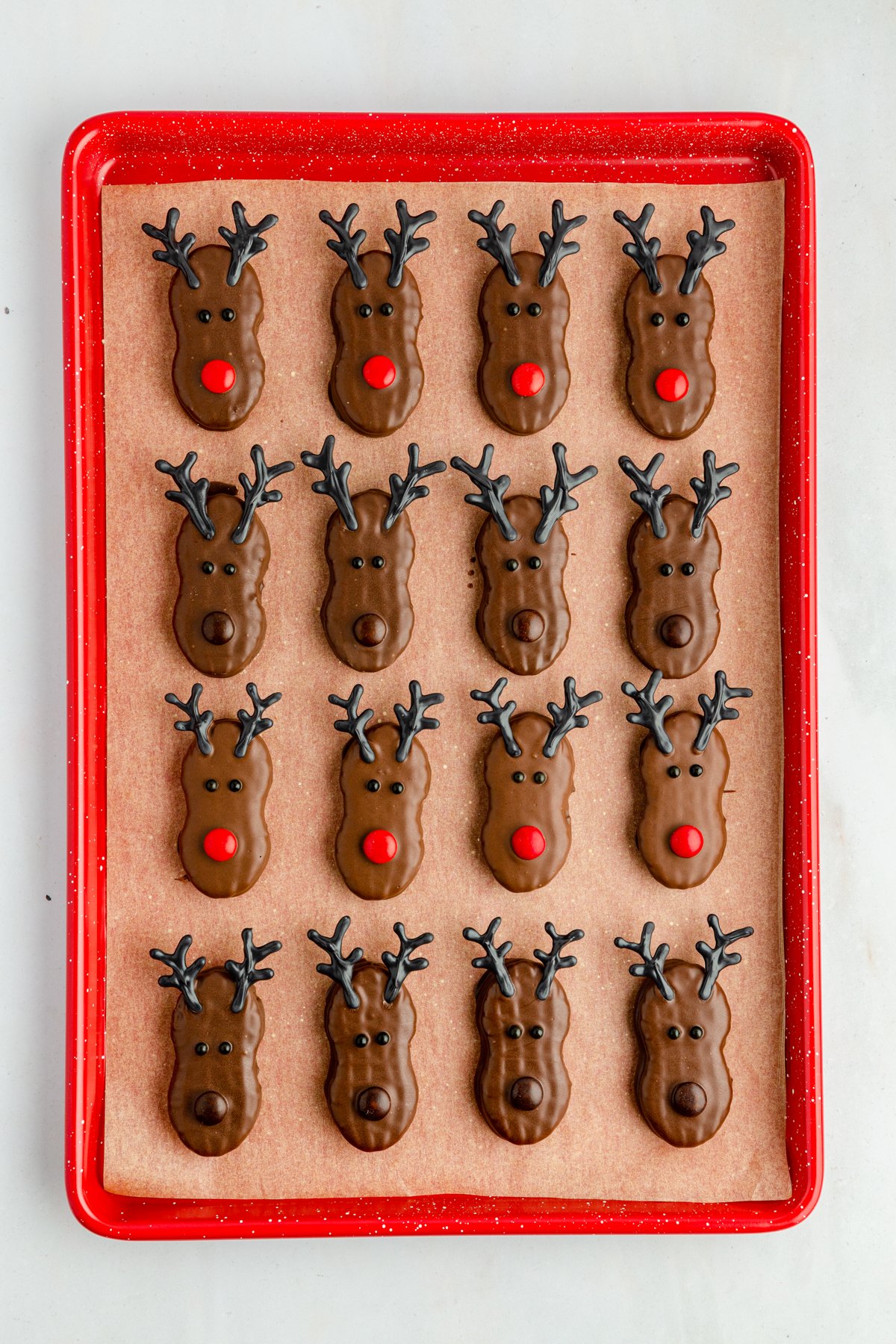 baking sheet full of Nutter Butter reindeer