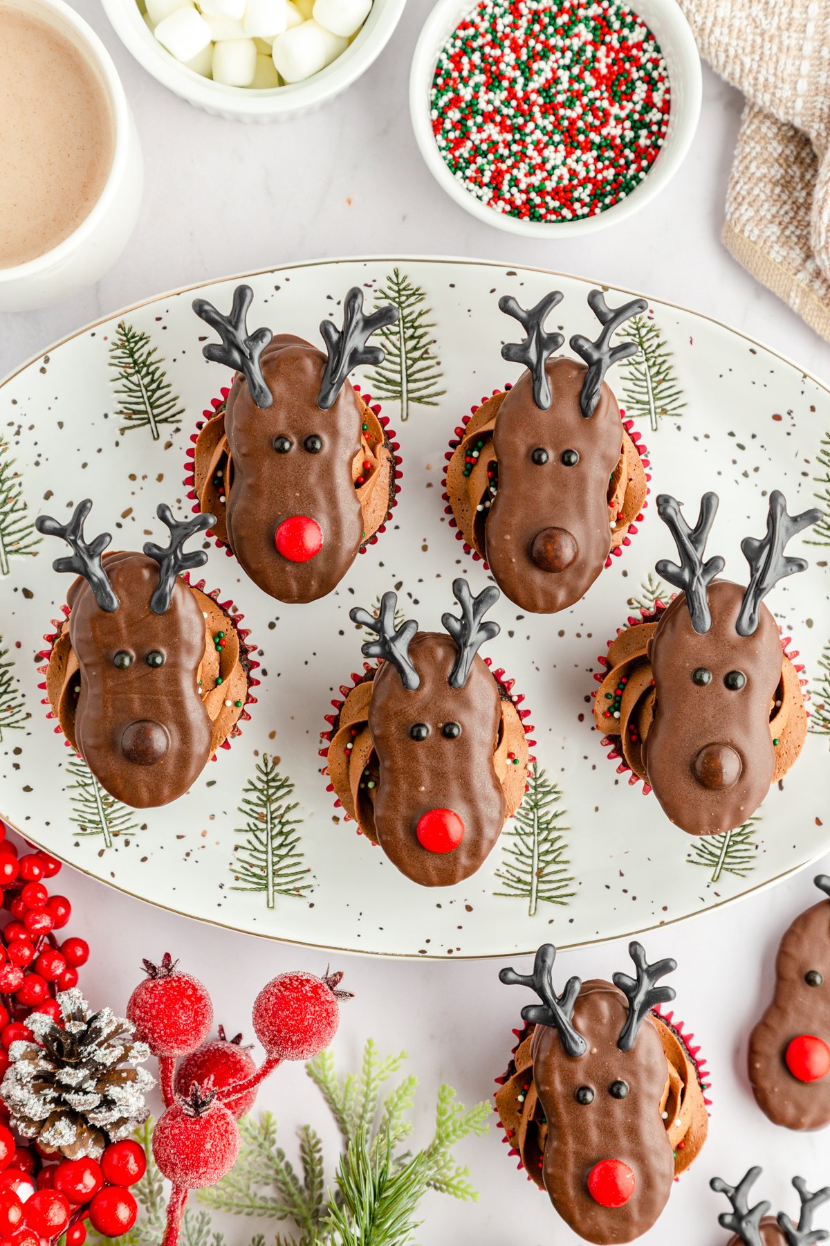 white plate full of reindeer cupcakes