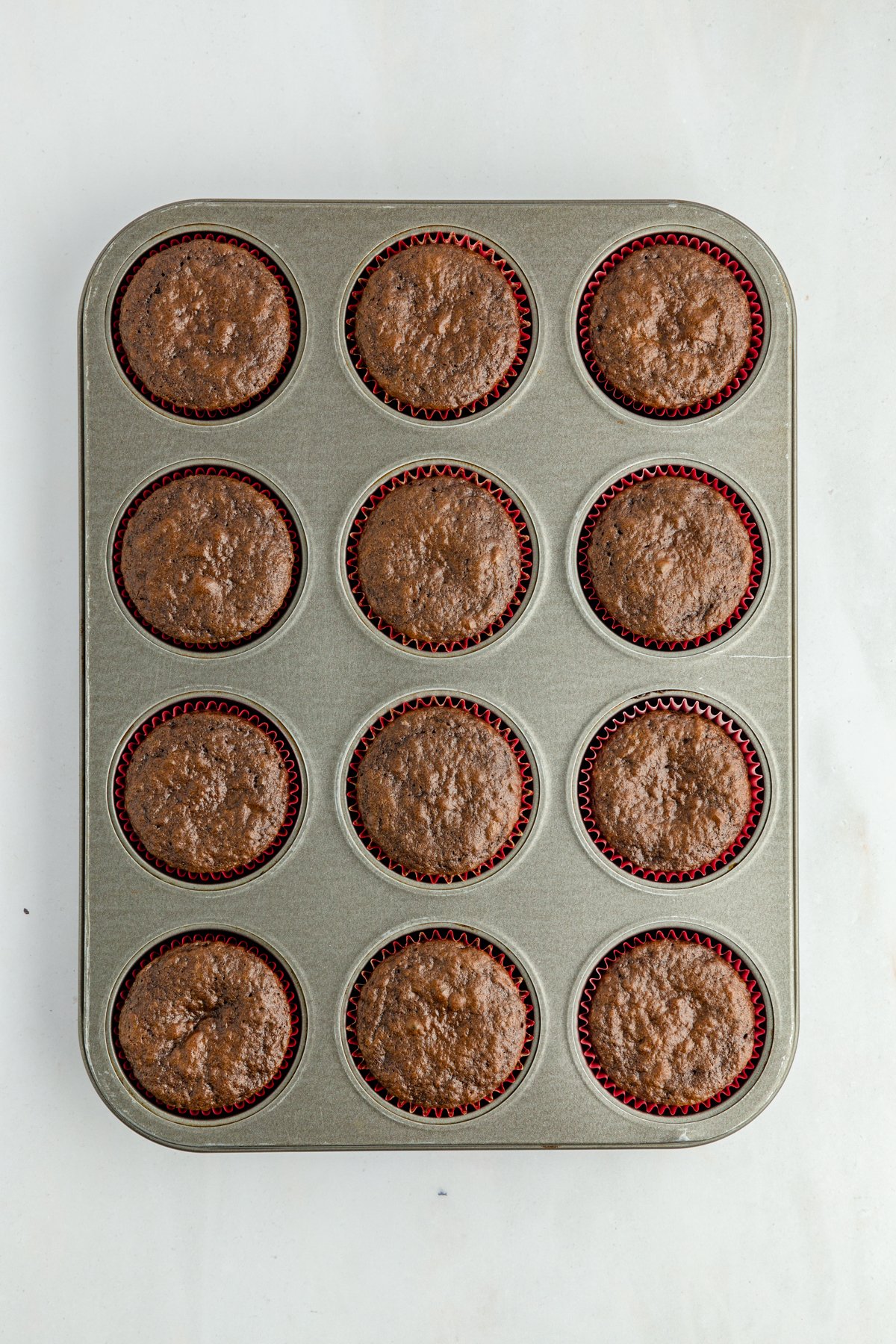 baked chocolate cupcakes in a muffin tin