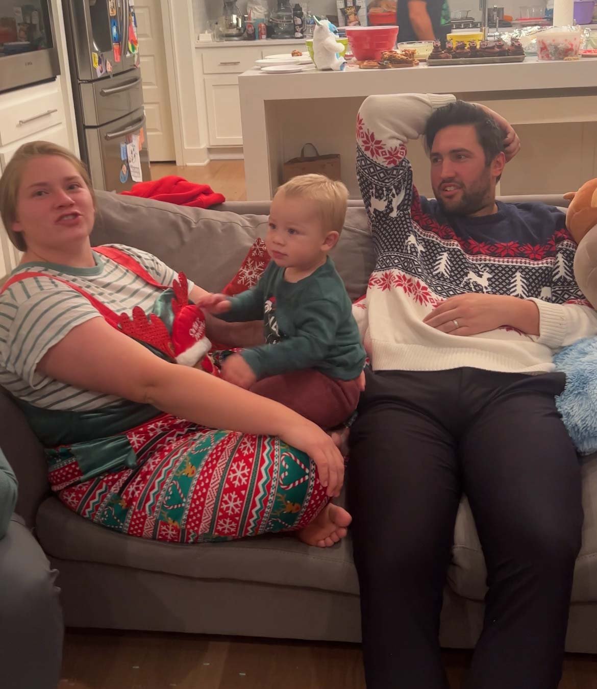 team of people sitting with a baby