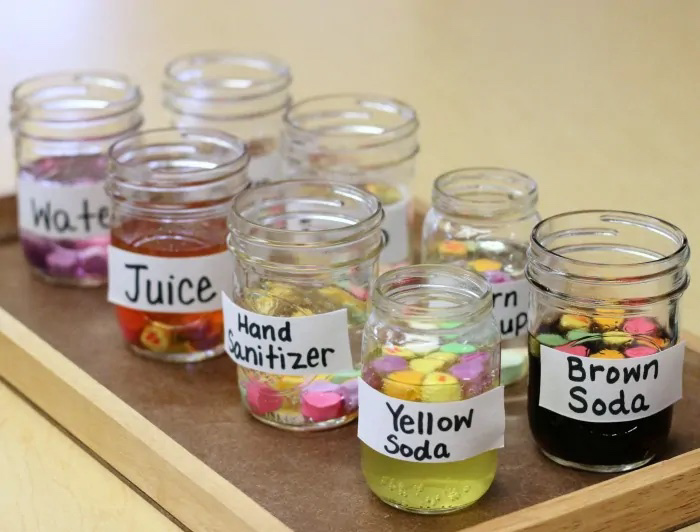 variety of labeled jars with varying drinks in them