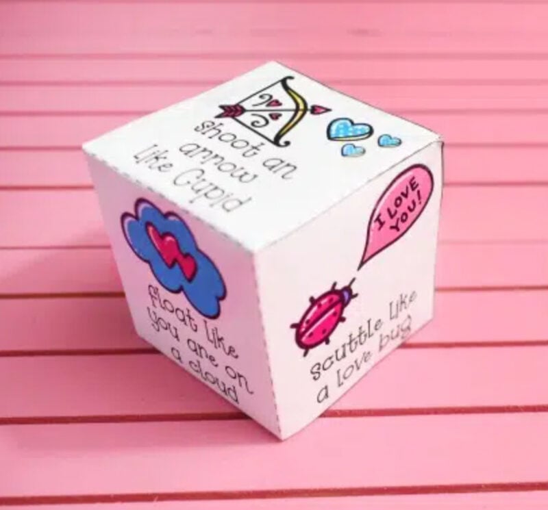 paper cube with various of activities printed on side
