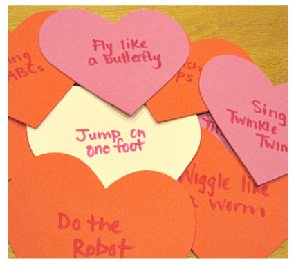 pile of paper hearts with various actions written on them