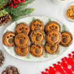 white plate with a bunch of bear paw cookies