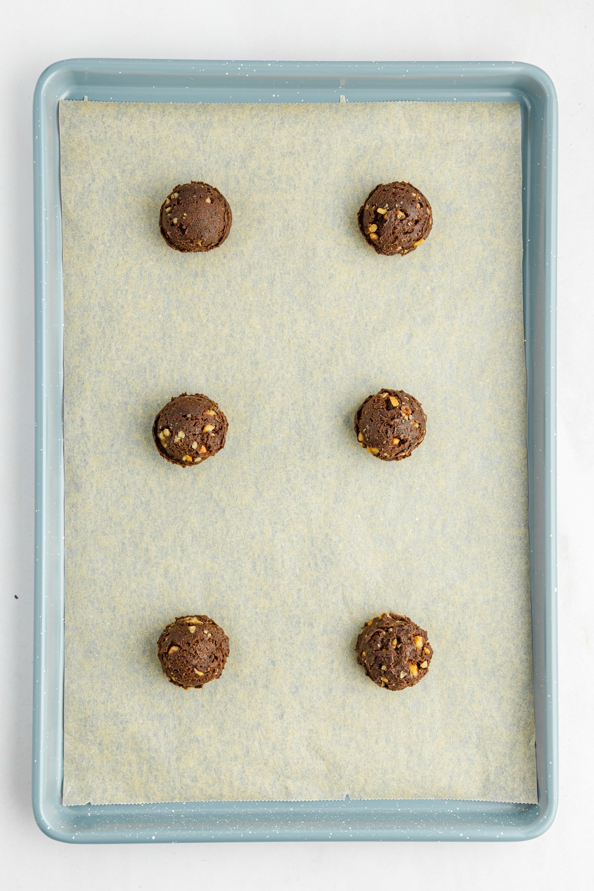 chocolate cookie dough on a baking sheet