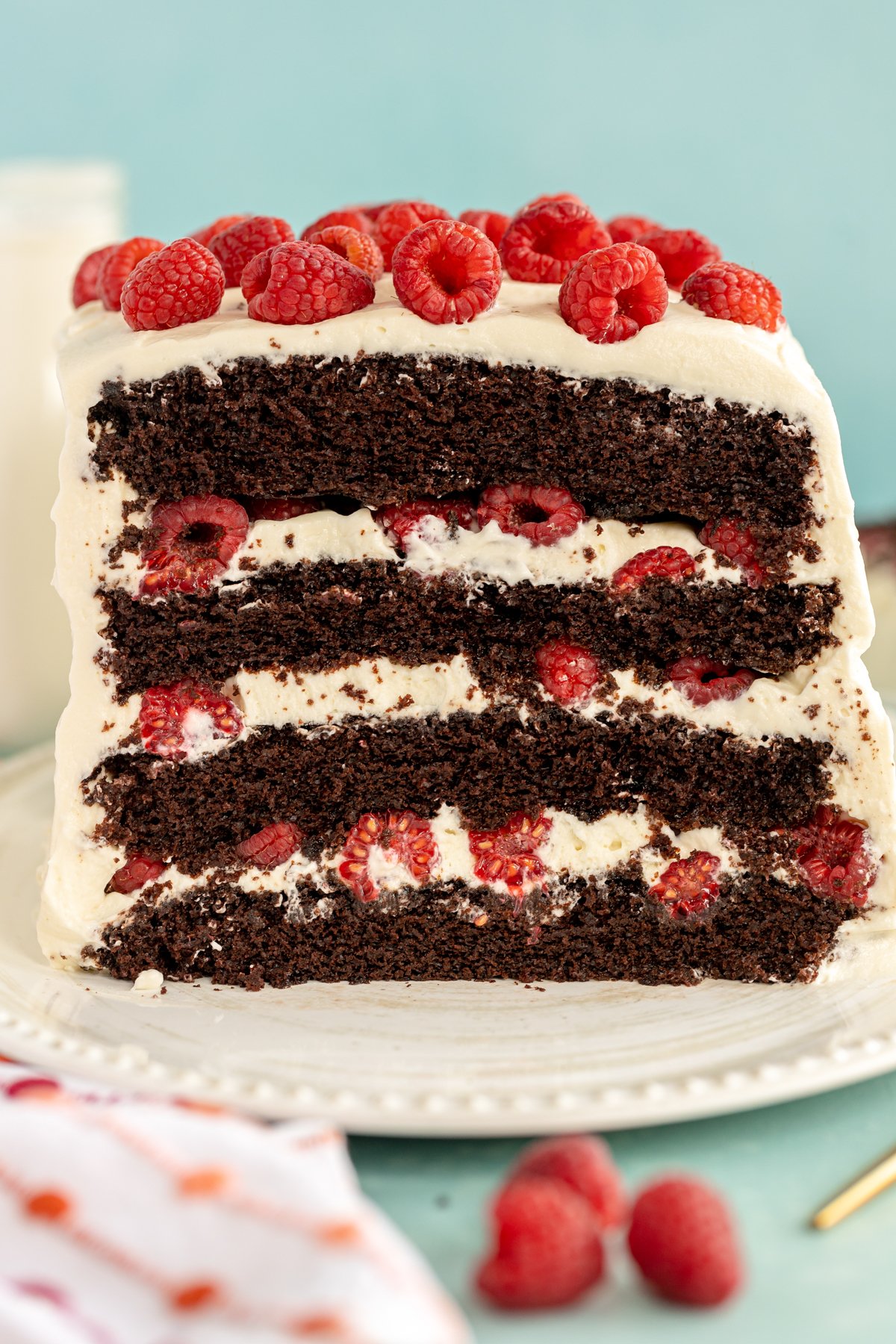 a chocolate raspberry cake with whipped cream frosting 