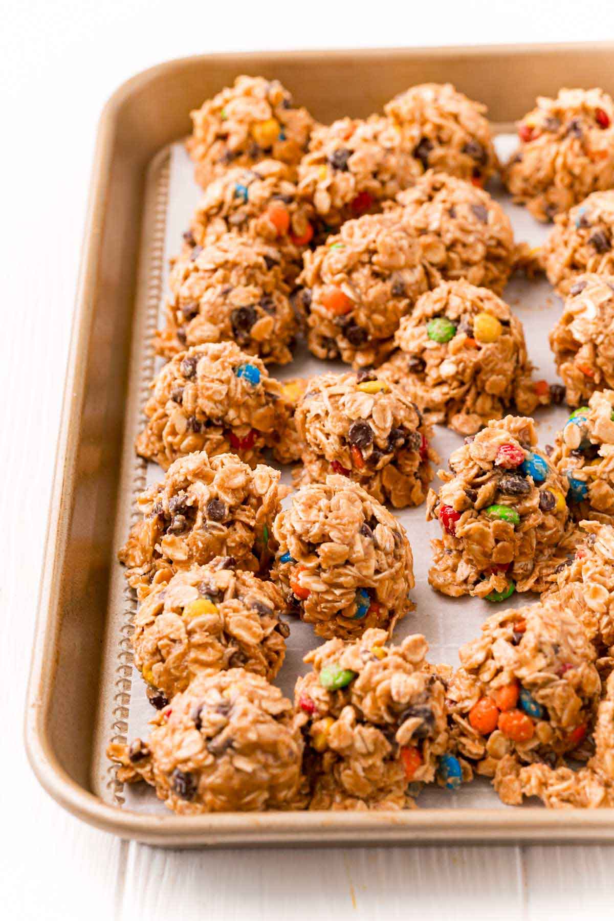 baking sheet with monster cookie dough on it