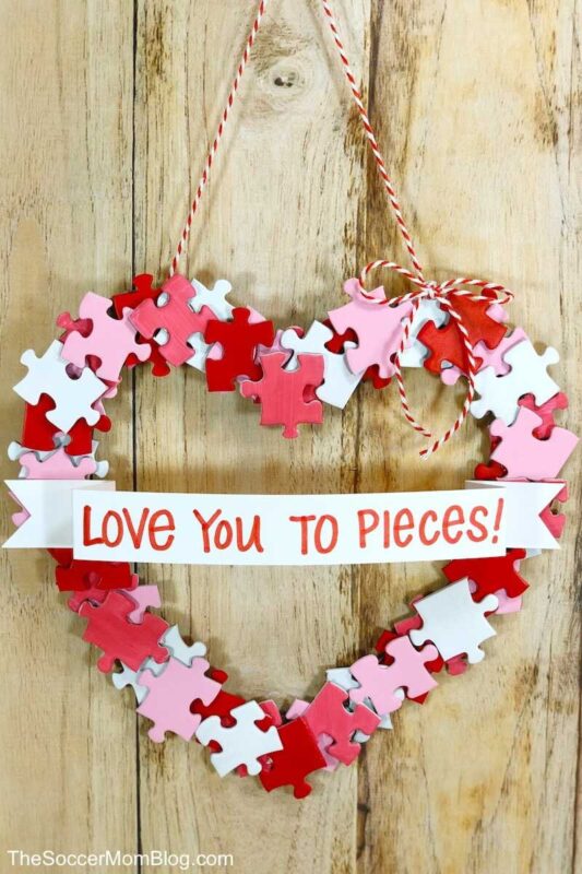 heart shaped wreath made with variety colored puzzle pieces
