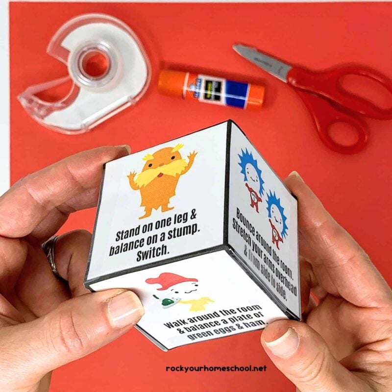 hand holding a Dr Seuss inspired activity cube