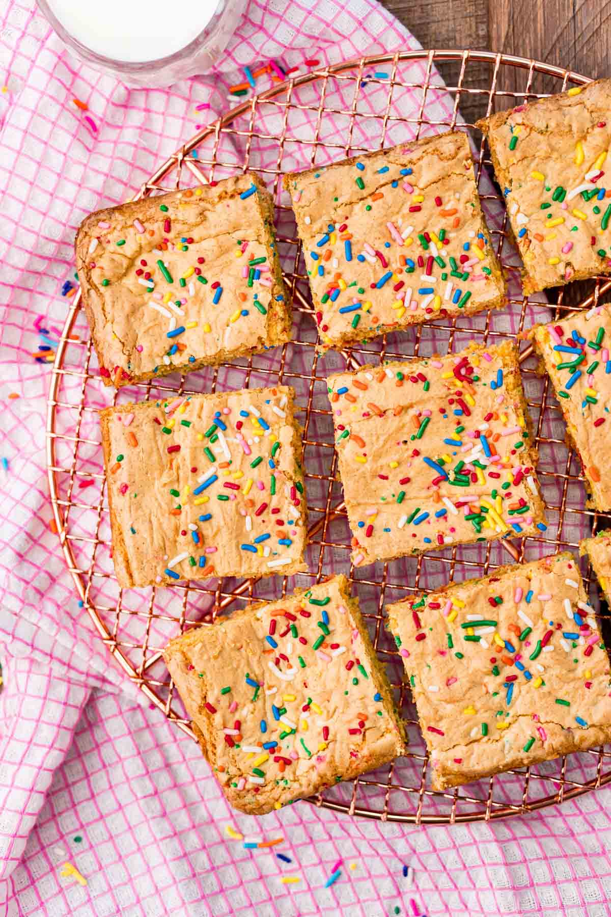 birthday cake blondies on a cooling rack