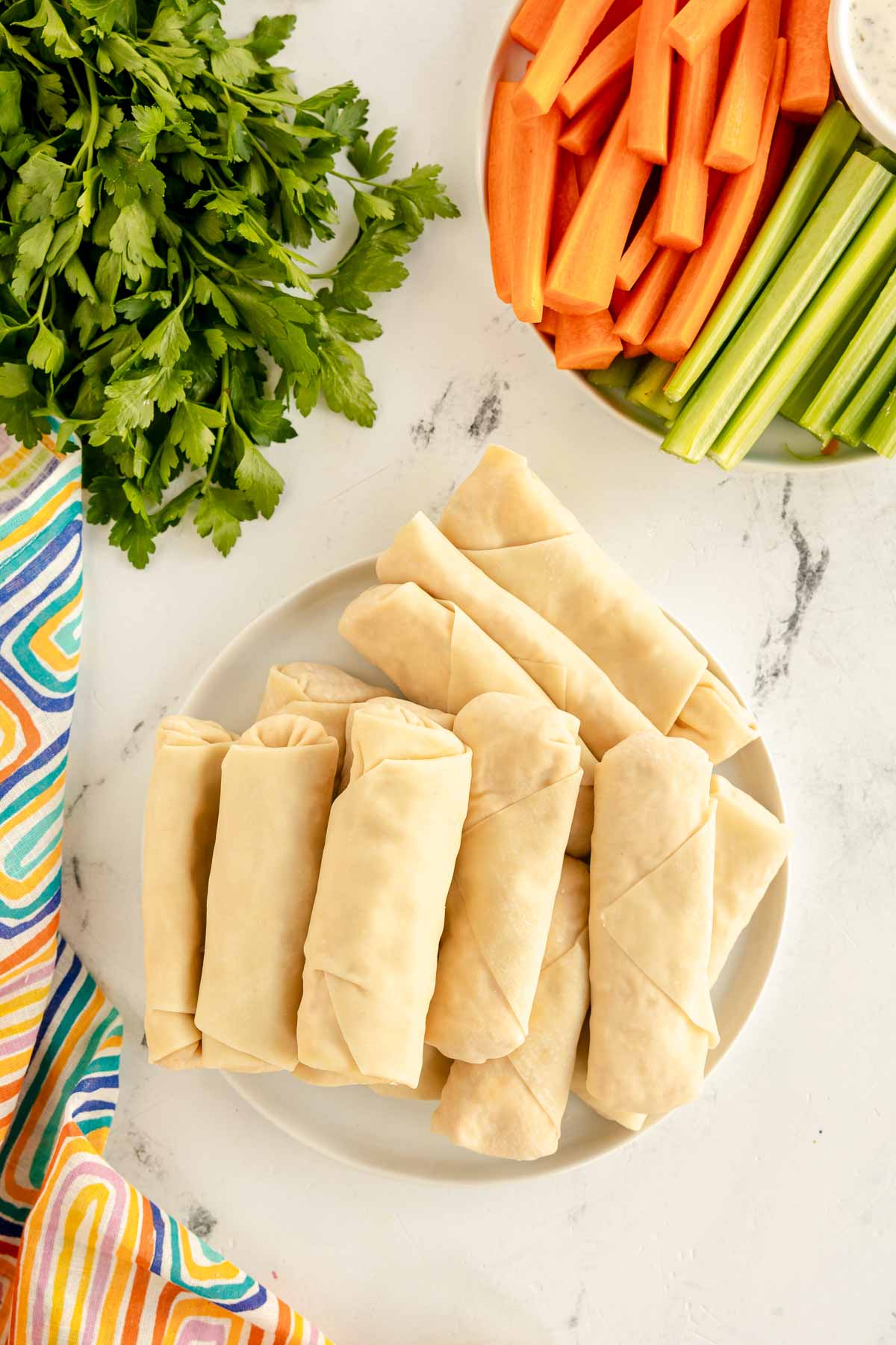 Stack of prepared egg rolls ready to be cooked 