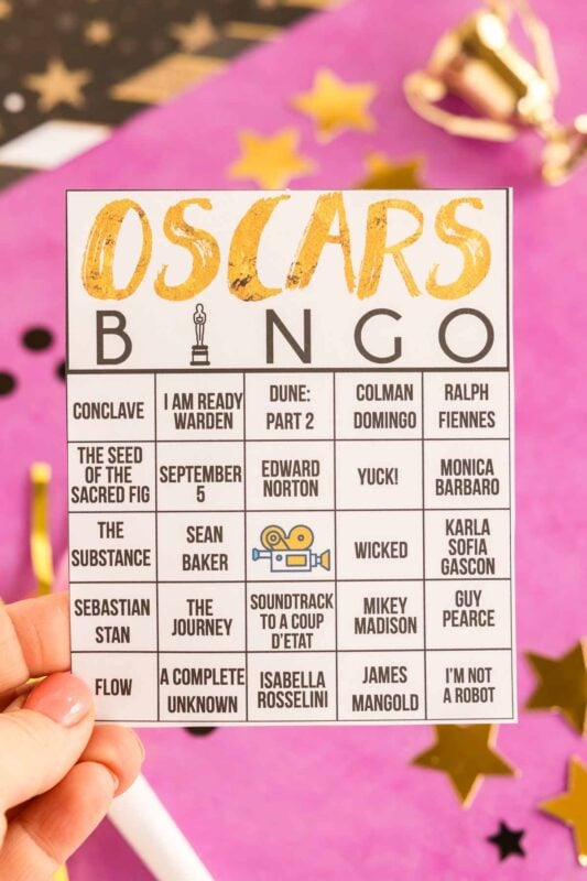 hand holding an Oscar bingo card