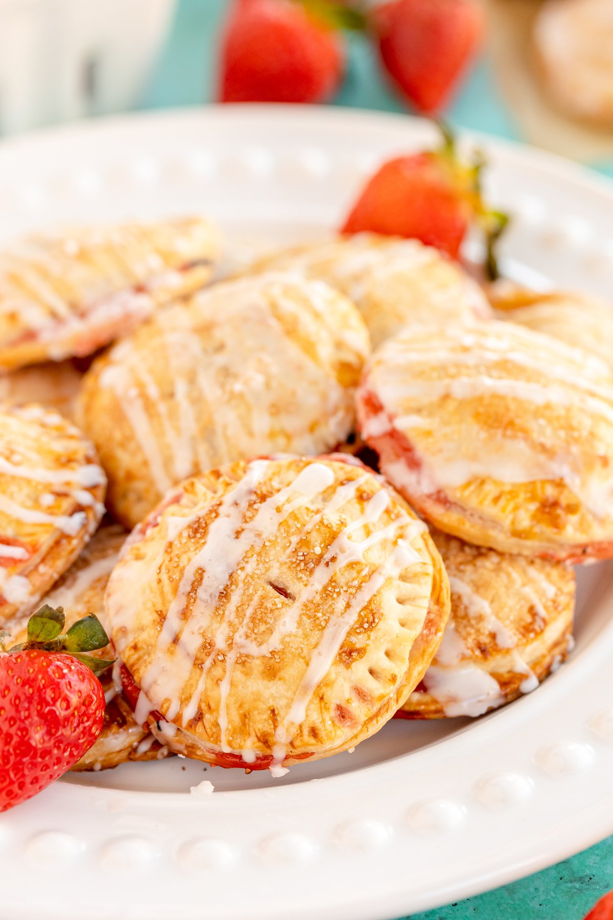 strawberry hand pies on a white plate