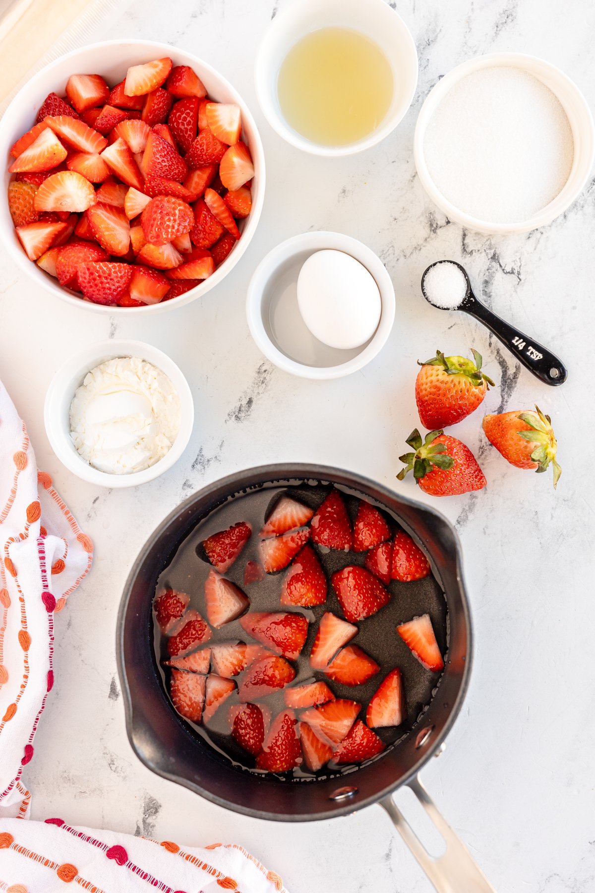 strawberries and water in a pan