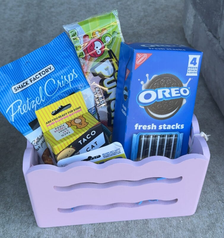 basket filled with snacks and games