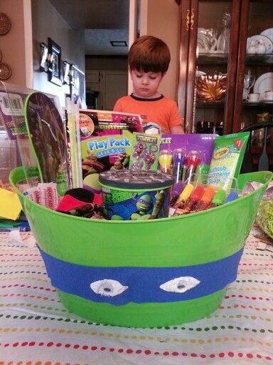 green bucket with ninja mask and variety of ninja toys