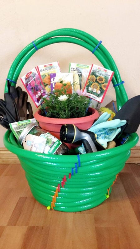 gardening hose turned into an easter basket filled with gardening supplies