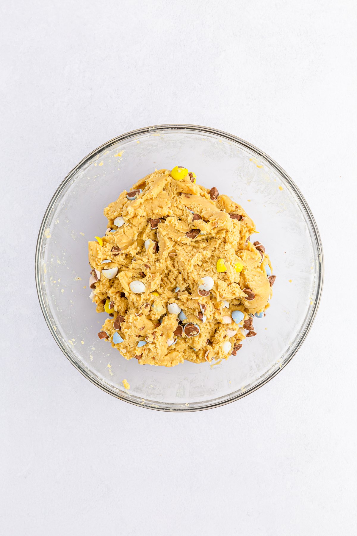 cadbury egg cookie bar dough in a glass bowl