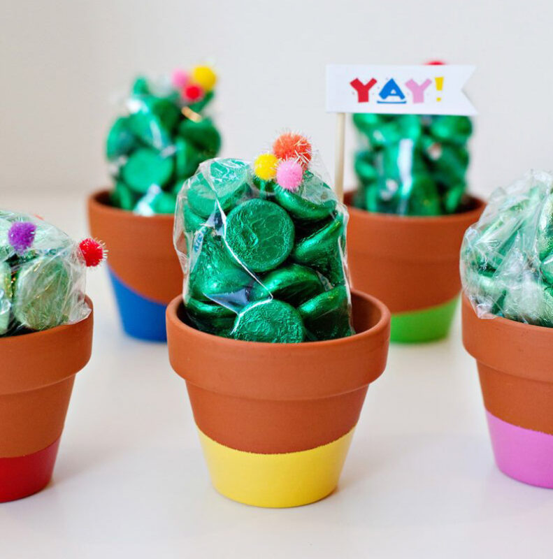 painted clay pots with green hershey kisses that look like a cactus