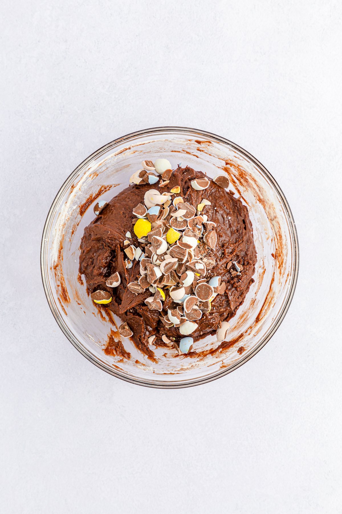 mini eggs brownies batter in a glass bowl