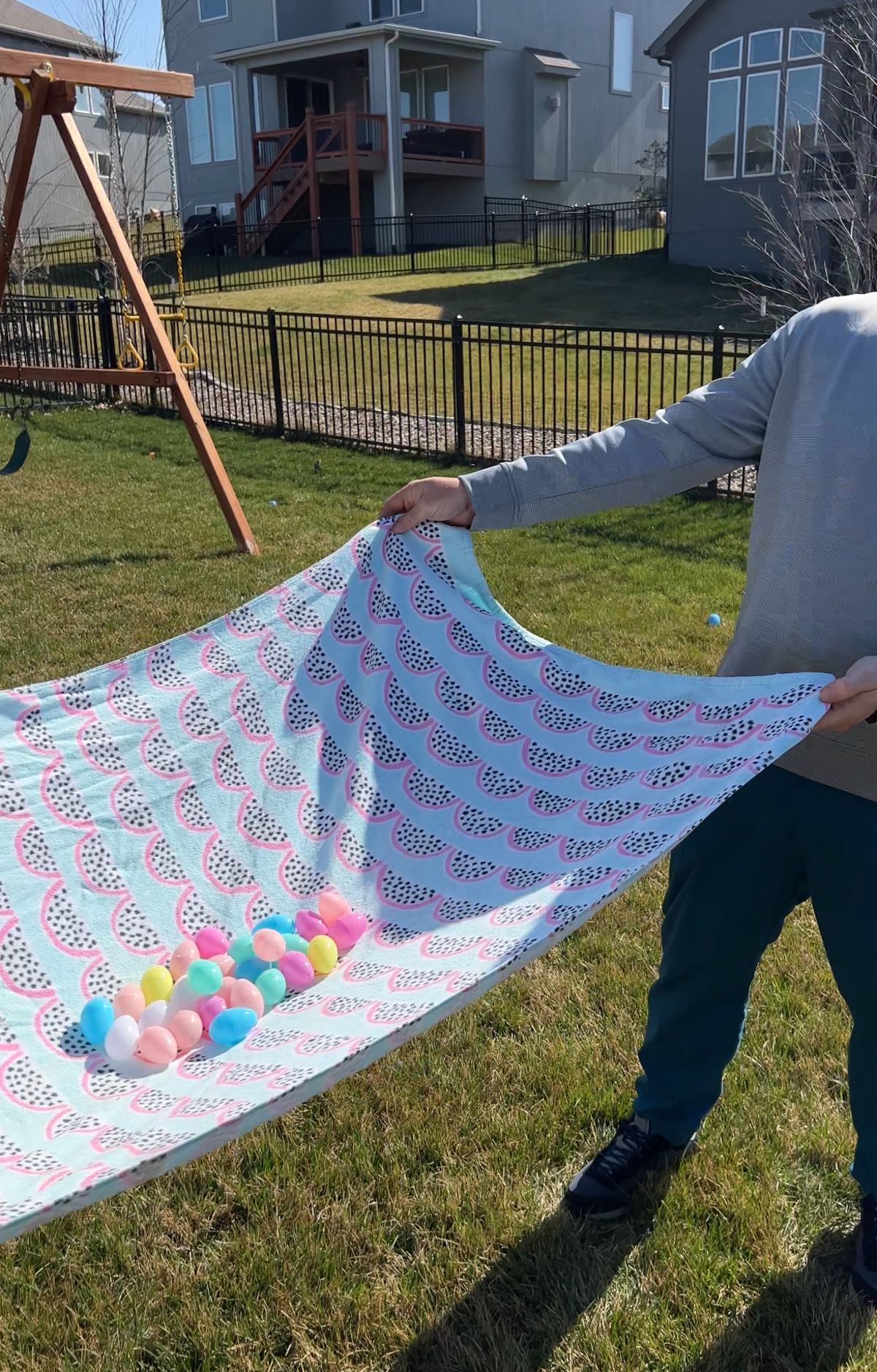 a bunch of plastic eggs in a beach towel for an egg toss