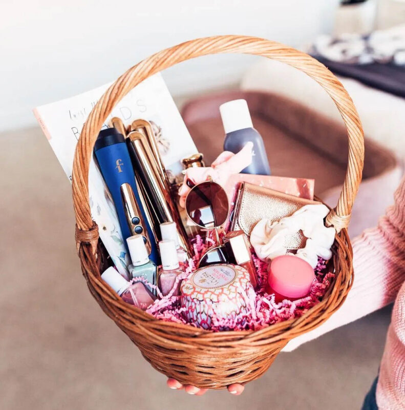woven basket with variety of beauty products and hair tools