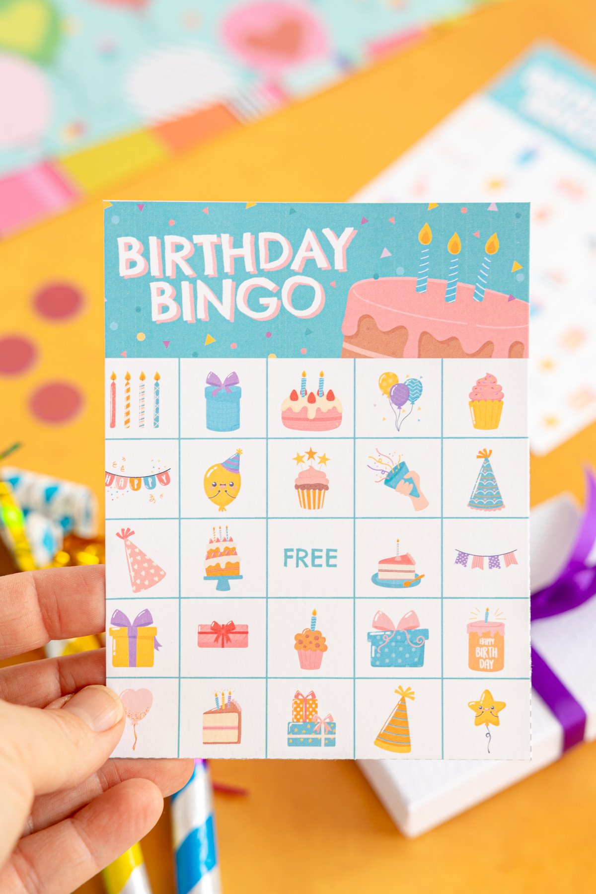 hand holding a birthday bingo card