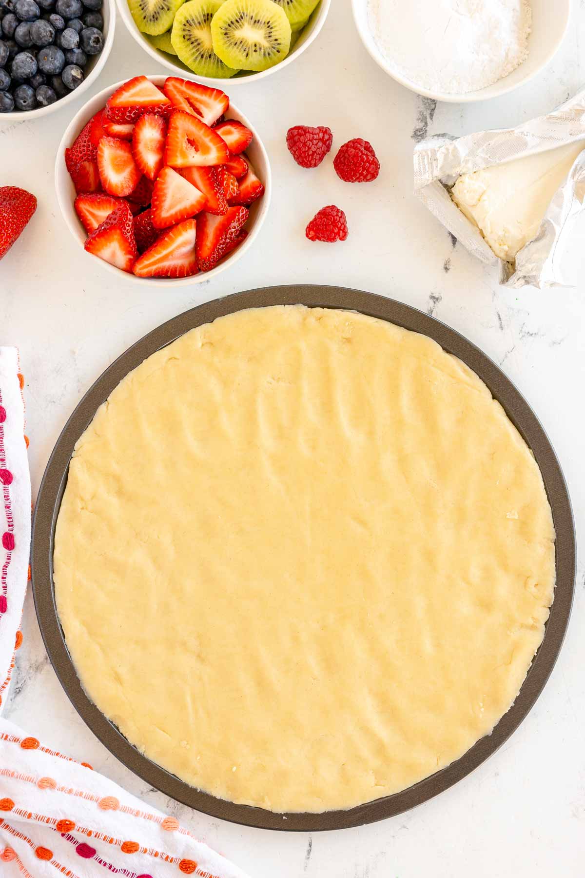 sugar cookie dough on a pizza pan