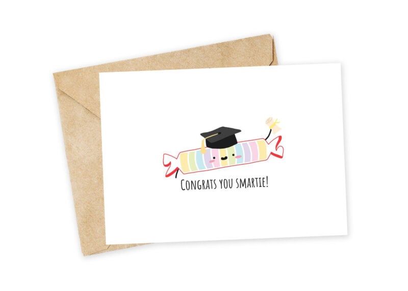 white card with Smartee candy wearing graduation cap
