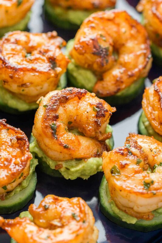 cucumbers topped with avocado and shrimp