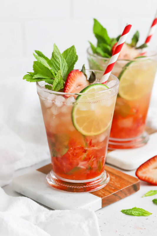 strawberry mint julep mocktail garnished with lime mint and strawberry