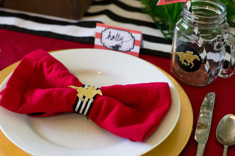 red napkins with DIY horse napkin rings that looks like a bow tie