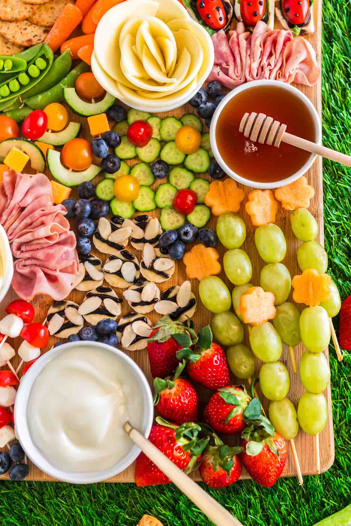 picnic charcuterie board with melon flowers