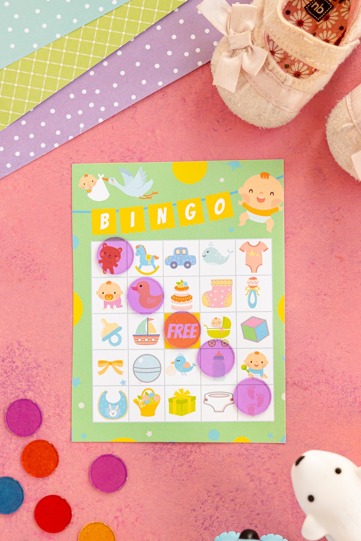 printed out baby shower bingo card with markers across it