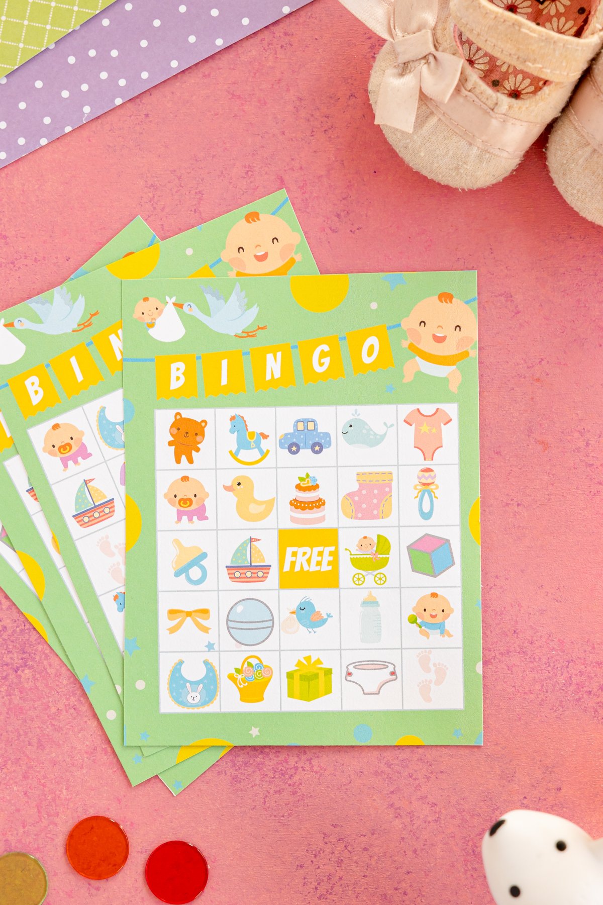 Three baby shower bingo cards stacked on top of each other