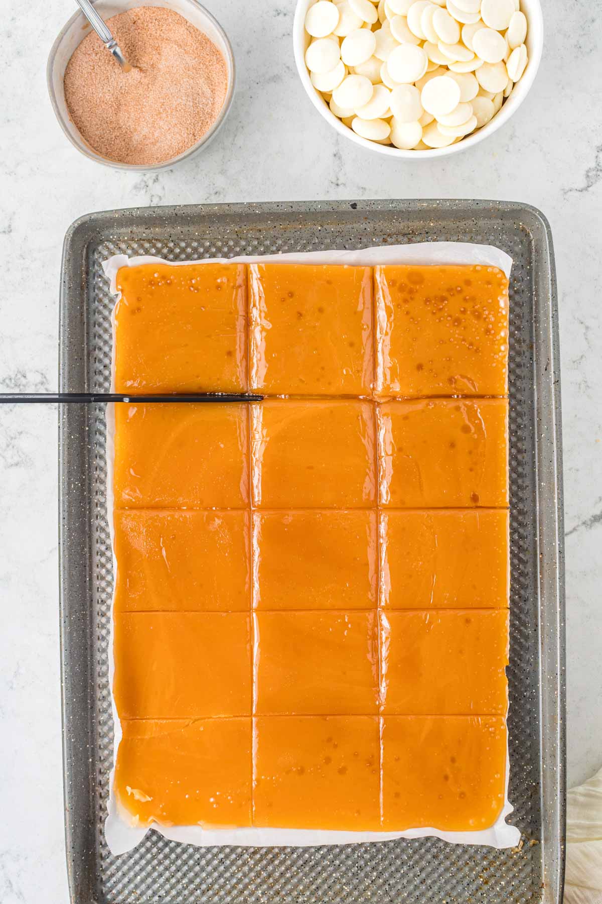 sliced pieces of toffee on a baking sheet