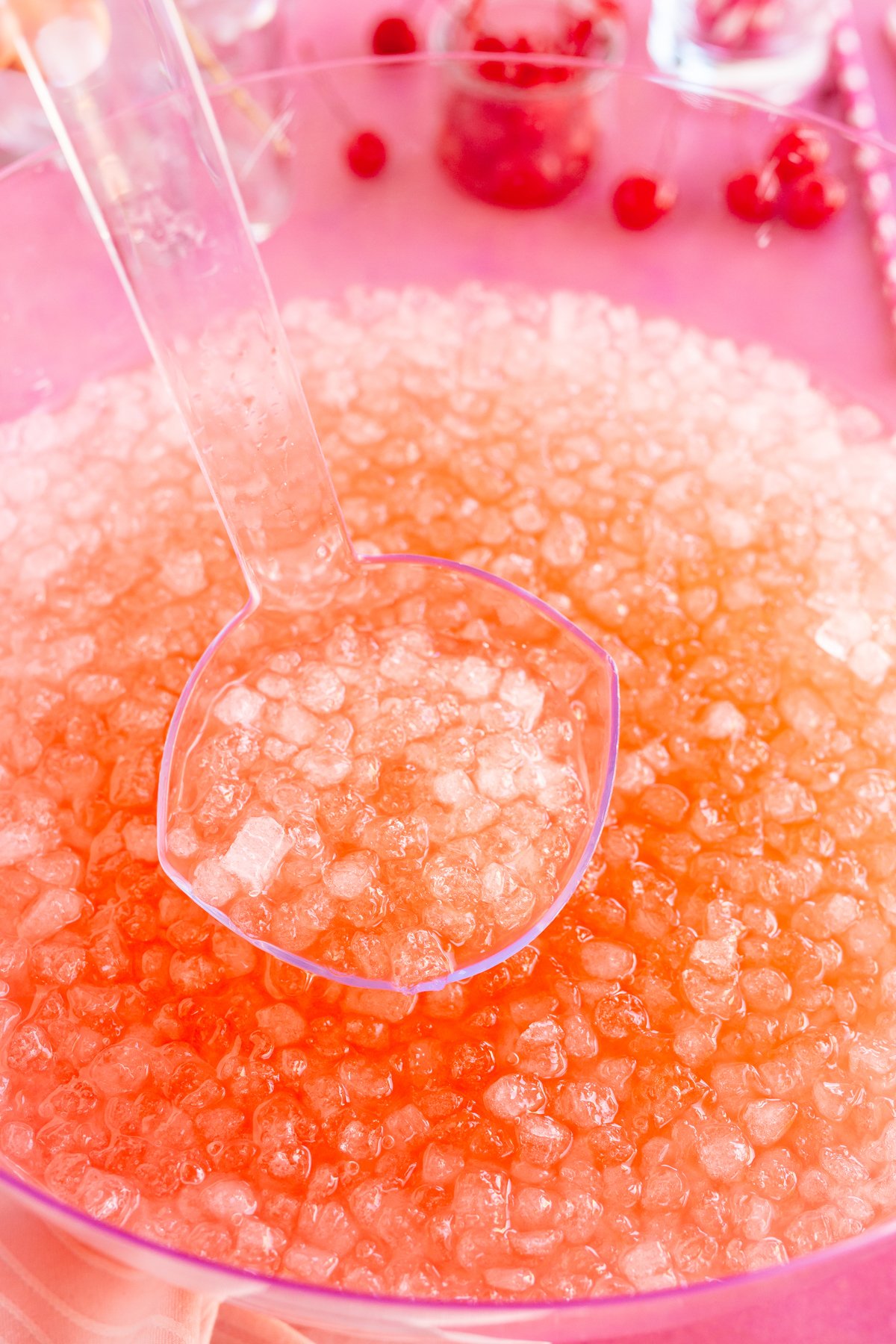 ladle in a punch bowl filled with baby shower pink punch