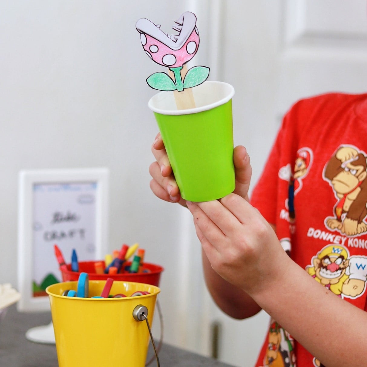 hand holding a Mario pipe craft