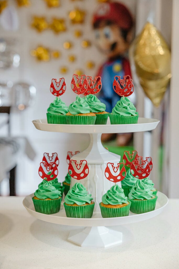 green cupcakes with pirahna plant toppers