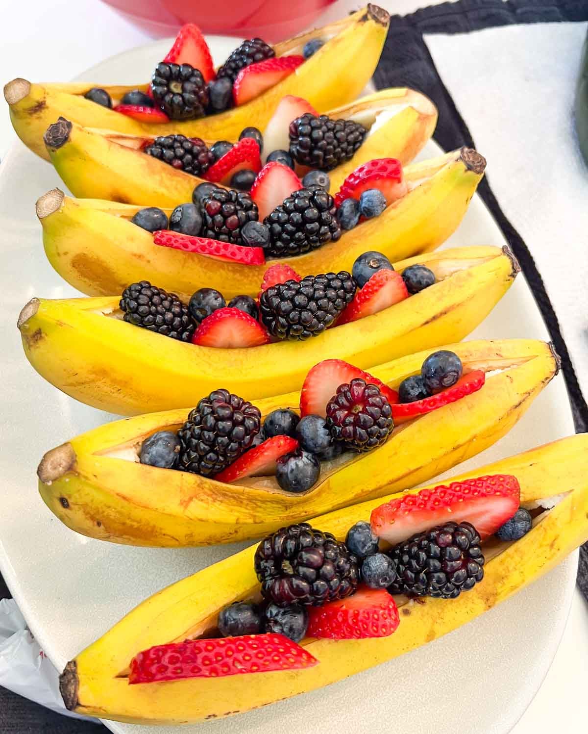 sliced berries in banana peels