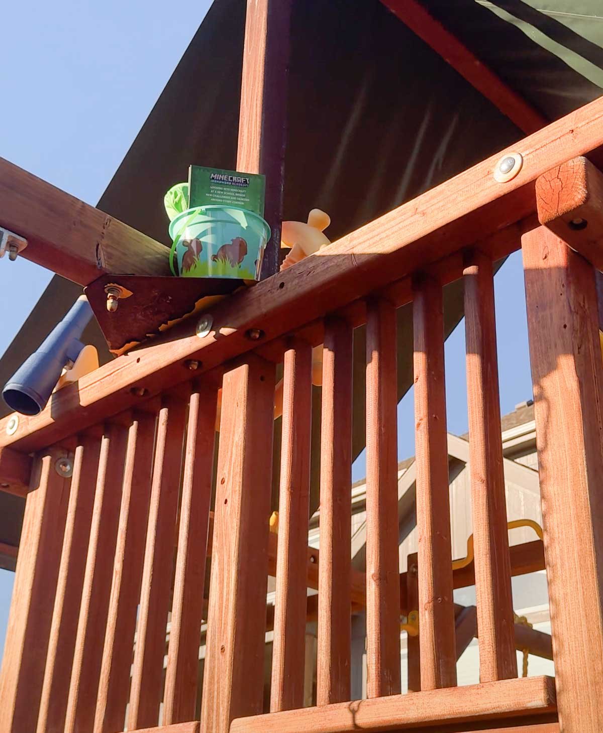 Easter basket hidden on top of a swing set