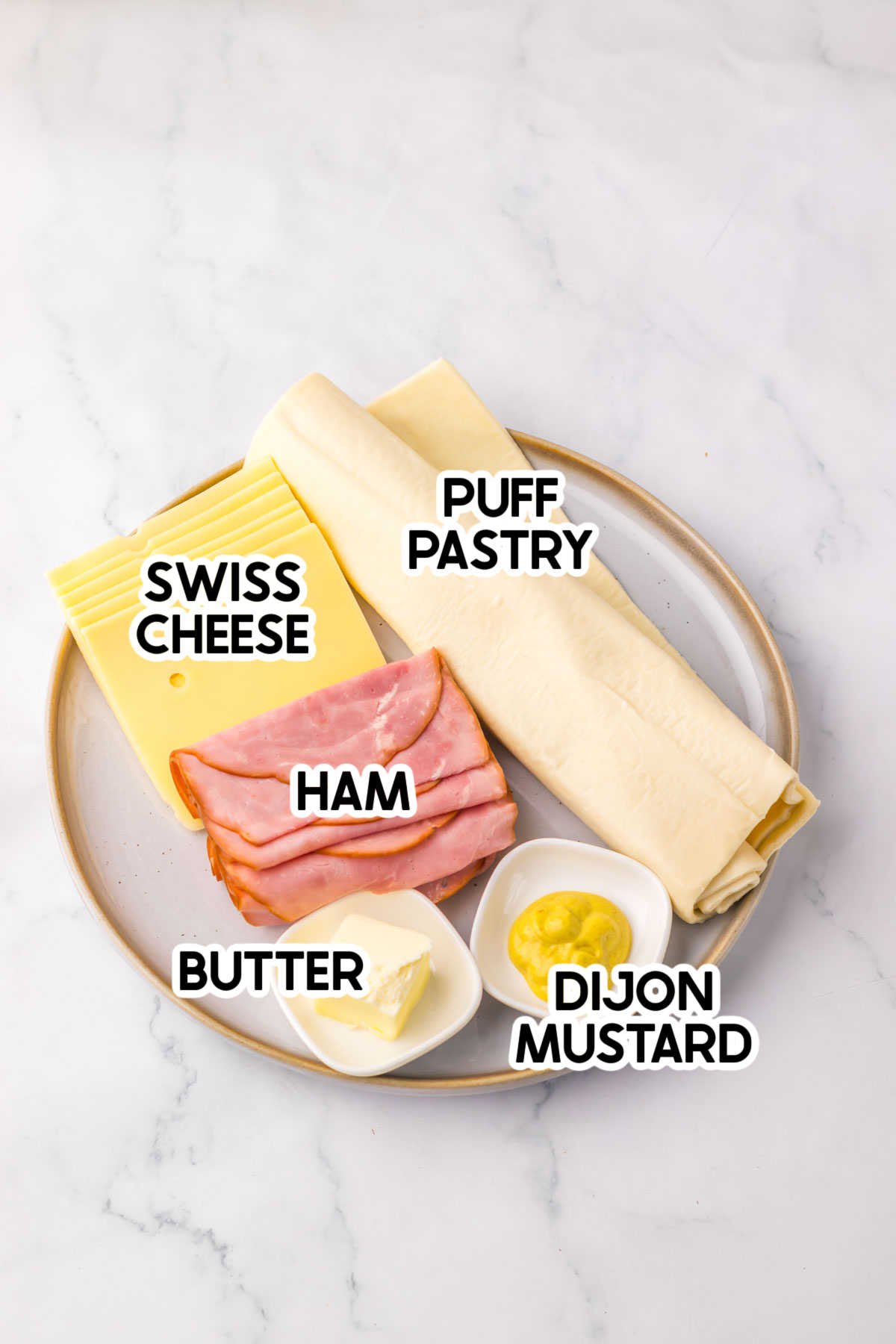 plate with ingredients to make a ham and cheese appetizer for Easter