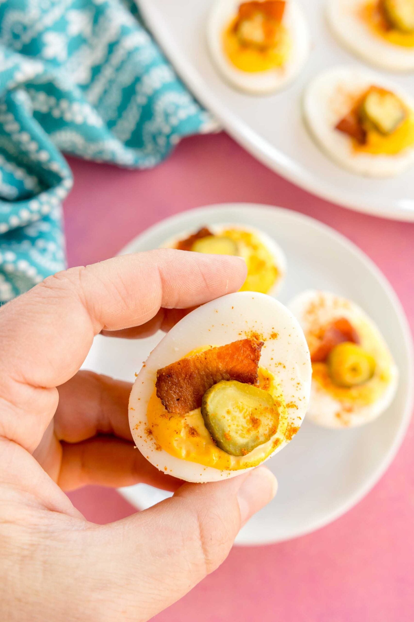 hand holding a million dollar deviled egg