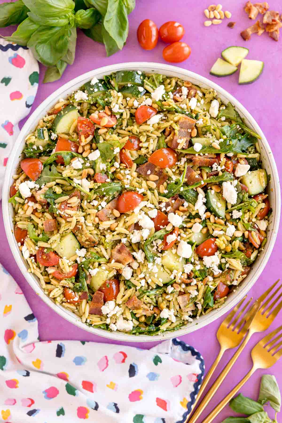 white bowl with pesto orzo salad
